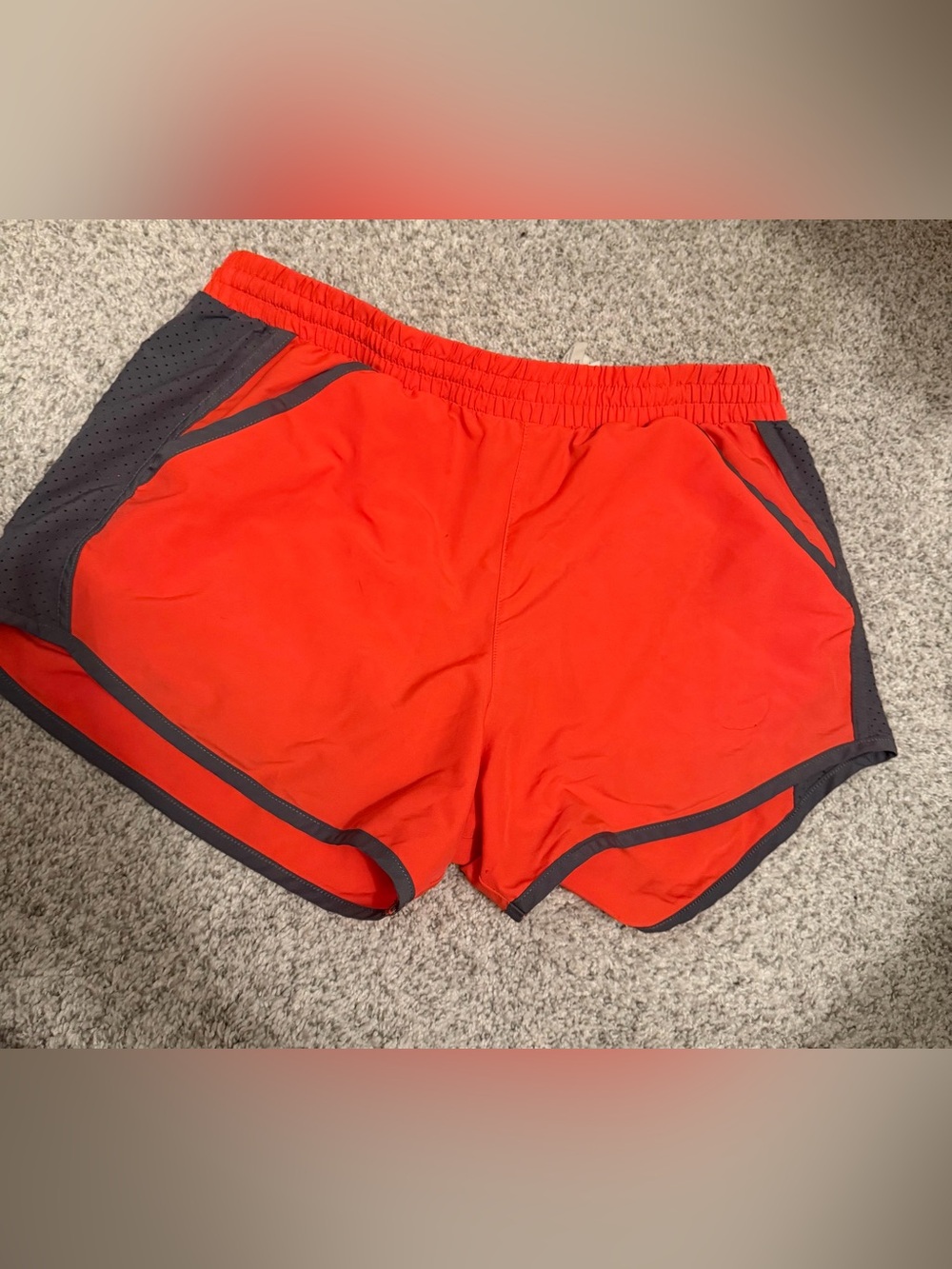 Orange Under Armour shorts